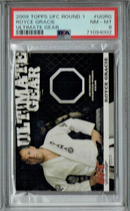 PSA 8 NM-MT Royce Gracie 2009 Topps UFC Round 1 #UGRG Rookie Card Ultimate Gear #134/500